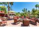 Relaxing fire pit area with wicker chairs and patio tables at 1817 E Hayward Ave # 3, Phoenix, AZ 85020