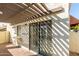 Private patio with a pergola and sliding glass door at 1817 E Hayward Ave # 3, Phoenix, AZ 85020