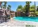 Stunning pool with waterfall feature and patio seating at 1817 E Hayward Ave # 3, Phoenix, AZ 85020