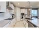 Modern kitchen with white cabinets, stainless steel appliances, and grey counters at 18202 W Cielo Grande Ave, Surprise, AZ 85387