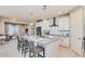 Modern kitchen with white cabinets, large island, and stainless steel appliances at 18202 W Cielo Grande Ave, Surprise, AZ 85387