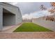 Artificial turf backyard with covered patio at 18972 W Woodlands Ave, Buckeye, AZ 85326