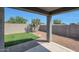 Artificial turf backyard with covered patio at 18972 W Woodlands Ave, Buckeye, AZ 85326