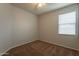 Simple bedroom with brown carpet and ceiling fan at 18972 W Woodlands Ave, Buckeye, AZ 85326