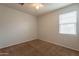 Bedroom with ceiling fan and carpet at 18972 W Woodlands Ave, Buckeye, AZ 85326