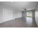 Bright bedroom with carpet flooring and sliding door closet at 18972 W Woodlands Ave, Buckeye, AZ 85326