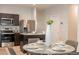 Kitchen and dining area with seating for four at 18972 W Woodlands Ave, Buckeye, AZ 85326