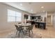 Dining area with kitchen views and seating for four at 18972 W Woodlands Ave, Buckeye, AZ 85326