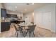 Dining area with kitchen views and seating for four at 18972 W Woodlands Ave, Buckeye, AZ 85326