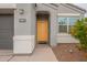 Front door and entryway of a gray house at 18972 W Woodlands Ave, Buckeye, AZ 85326