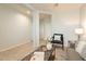 Spacious living room with a view into hallway at 18972 W Woodlands Ave, Buckeye, AZ 85326