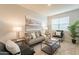 Relaxing living room, featuring a comfy couch and natural light at 18972 W Woodlands Ave, Buckeye, AZ 85326