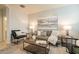 Cozy living room featuring a gray sofa and stylish coffee table at 18972 W Woodlands Ave, Buckeye, AZ 85326