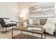 Sophisticated living room with a gray sofa and modern decor at 18972 W Woodlands Ave, Buckeye, AZ 85326