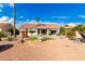 Backyard oasis with fountain and desert landscaping at 19619 N White Rock Dr, Sun City West, AZ 85375