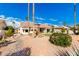 Spacious backyard with artificial turf and desert plants at 19619 N White Rock Dr, Sun City West, AZ 85375