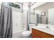 Bathroom with shower/tub combo and wood vanity at 19619 N White Rock Dr, Sun City West, AZ 85375