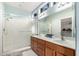 Double vanity bathroom with a shower and walk-in closet at 19619 N White Rock Dr, Sun City West, AZ 85375