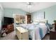 Serene bedroom with a king-size bed and built-in shelving at 19619 N White Rock Dr, Sun City West, AZ 85375