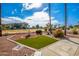 Neat front yard with artificial turf and fountain at 19619 N White Rock Dr, Sun City West, AZ 85375