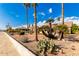 Front yard with desert landscaping and stone wall at 19619 N White Rock Dr, Sun City West, AZ 85375