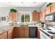 Spacious kitchen featuring granite countertops and wood cabinets at 19619 N White Rock Dr, Sun City West, AZ 85375