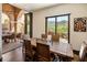 Elegant dining room with sliding doors leading to the patio at 19627 N 101St St, Scottsdale, AZ 85255