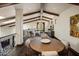 Open loft area with wood beams, seating, and dining table at 19627 N 101St St, Scottsdale, AZ 85255