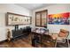 Home office with built-in shelving and hardwood floors at 19627 N 101St St, Scottsdale, AZ 85255