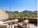 Cozy patio with fire pit and mountain views at 19627 N 101St St, Scottsdale, AZ 85255