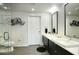 Modern bathroom with double sinks, large mirror, and glass shower at 200 W Portland St # 817, Phoenix, AZ 85003