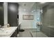 Elegant bathroom featuring a double vanity and frameless shower at 200 W Portland St # 817, Phoenix, AZ 85003