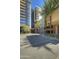 Building exterior showing courtyard entrance and landscaping at 200 W Portland St # 817, Phoenix, AZ 85003