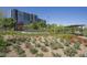 Lush landscaping surrounds a modern building, creating a serene and inviting outdoor space at 200 W Portland St # 817, Phoenix, AZ 85003