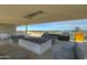 Relaxing rooftop terrace with fire pit, seating, and grills, overlooking city skyline at 200 W Portland St # 817, Phoenix, AZ 85003