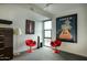 Cozy sitting area with two red chairs and large window at 200 W Portland St # 817, Phoenix, AZ 85003