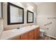 Bathroom with double vanity, large mirrors, and accessible features at 201 S Greenfield Rd # 353, Mesa, AZ 85206