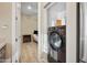 Stackable washer and dryer in a small laundry room with extra storage at 201 S Greenfield Rd # 353, Mesa, AZ 85206