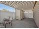 Covered patio with two chairs and small storage shed at 201 S Greenfield Rd # 353, Mesa, AZ 85206