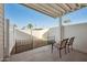 Covered patio with two chairs and small storage shed at 201 S Greenfield Rd # 353, Mesa, AZ 85206