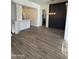 Bright dining room with modern light fixture and dark accent wall at 20801 N 90Th Pl # 161, Scottsdale, AZ 85255