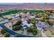 Aerial view of a house with a pool and surrounding farmlands at 2124 E Virginia St, Mesa, AZ 85213