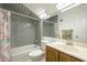 Bathroom with tiled shower and vanity at 2124 E Virginia St, Mesa, AZ 85213