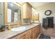 Double vanity bathroom with wood cabinets and tile flooring at 2124 E Virginia St, Mesa, AZ 85213