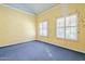 Bright bedroom with light walls and carpet at 2124 E Virginia St, Mesa, AZ 85213