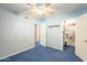 Bedroom with built-in shelves and adjacent closet at 2124 E Virginia St, Mesa, AZ 85213