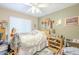 Bright bedroom with ceiling fan and ample closet space at 2124 E Virginia St, Mesa, AZ 85213