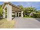 Spacious driveway leading to a covered entryway and well-maintained landscaping at 2124 E Virginia St, Mesa, AZ 85213