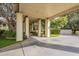 Covered walkway and driveway with lush landscaping at 2124 E Virginia St, Mesa, AZ 85213