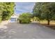 Large driveway leading to a two-car garage and house at 2124 E Virginia St, Mesa, AZ 85213